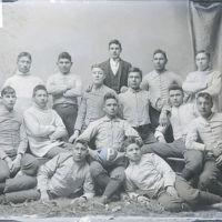 604px-Portrait_of_College_Football_Team,_The_-Pirates,-_in_Partial_Uniform,_and_with_Man_in_Business_Suit_1879.jpg