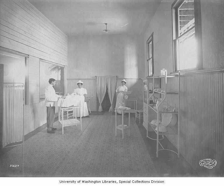 Nurses and a Baby in an Exam Room of the Baby Incubator Exhibit at the AYP Expo
